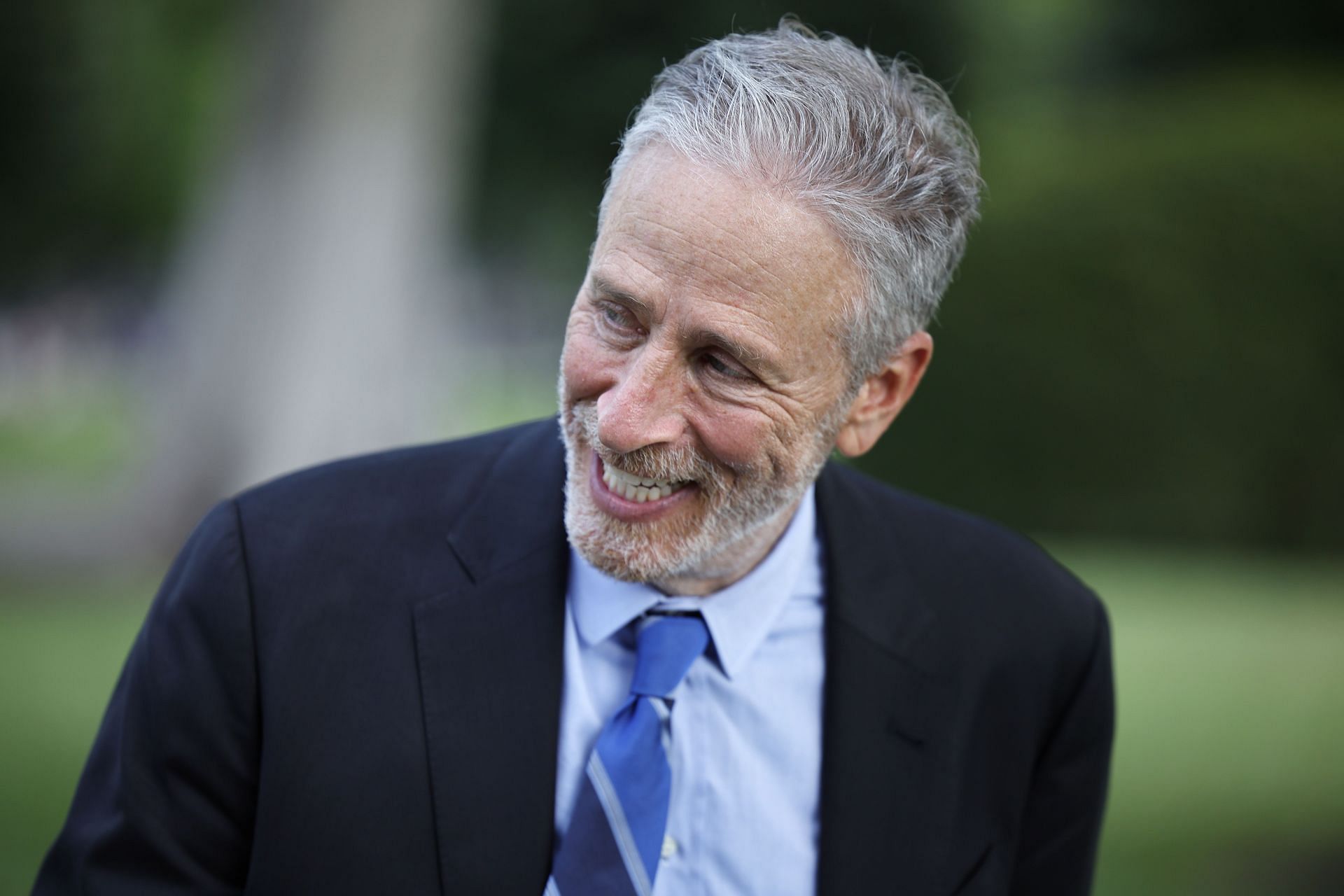 Jon Stewart opens The Daily Show by spoofing the viral X controversy, using the segment to explore political contradictions and social media outrage. (Image via Chip Somodevilla/Getty Images)